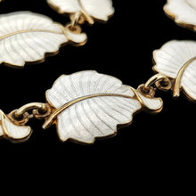 Load image into Gallery viewer, A white enamel leaf necklace in silver gilt, close-up

