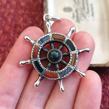 Load image into Gallery viewer, Victorian Silver Scottish Agate Ship&#39;s Wheel Pendant in hand
