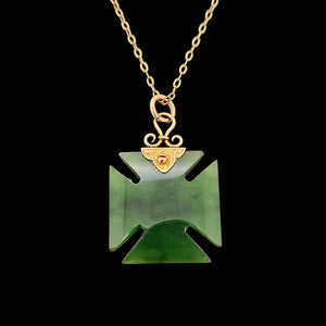 Victorian 9ct Gold Nephrite Jade Cross Pattée Pendant with a gold chain, on a black background