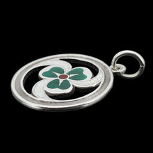 Load image into Gallery viewer, A silver enamel clover triskelion pendant, on a black background
