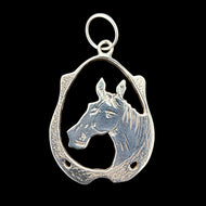 A silver horse and horseshoe pendant