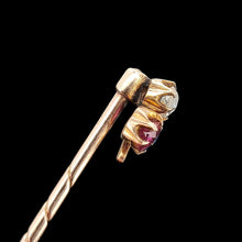 Load image into Gallery viewer, A ruby, sapphire and diamond clover shaped stick tie pin in gold, on a black background
