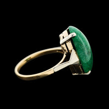 Load image into Gallery viewer, An oval nephrite jade ring in white and yellow gold, on a black background
