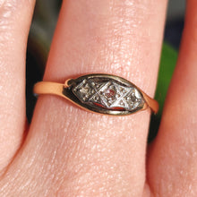 Load image into Gallery viewer, A three stone rose cut diamond ring in yellow gold and palladium, modelled on a hand
