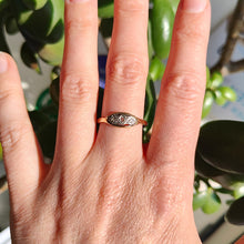 Load image into Gallery viewer, A three stone rose cut diamond ring in yellow gold and palladium, modelled on a hand
