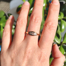 Load image into Gallery viewer, A three stone rose cut diamond ring in yellow gold and palladium, modelled on a hand
