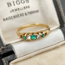 Load image into Gallery viewer, An emerald and diamond graduated five stone ring in yellow gold, in an antique ring box
