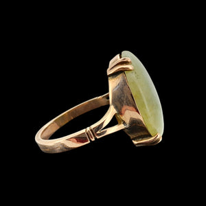 Vintage 9ct Rose Gold Nephrite Jade Statement Ring shown from the side, on a black background