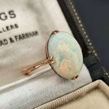 Load image into Gallery viewer, A single stone oval shaped, cabochon cut opal ring in rose gold, in an antique ring box
