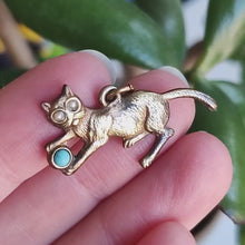 Load and play video in Gallery viewer, Antique Yellow Metal Cat Playing with Ball Charm, Circa 1900
