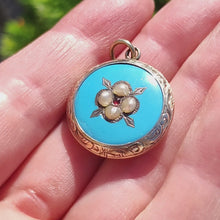 Load and play video in Gallery viewer, Victorian 9ct Gold Enamel, Pearl and Garnet Glazed Back Pendant
