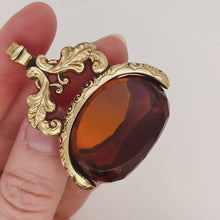 Load and play video in Gallery viewer, Large Antique 9ct Gold Cased Orange Glass Spinner Fob video
