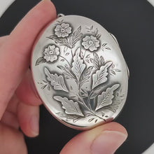 Load and play video in Gallery viewer, Victorian Sterling Silver Flower Oval Locket Pendant | Circa 1885
