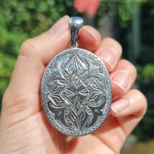 Load image into Gallery viewer, Antique Silver Engraved Locket Pendant in hand
